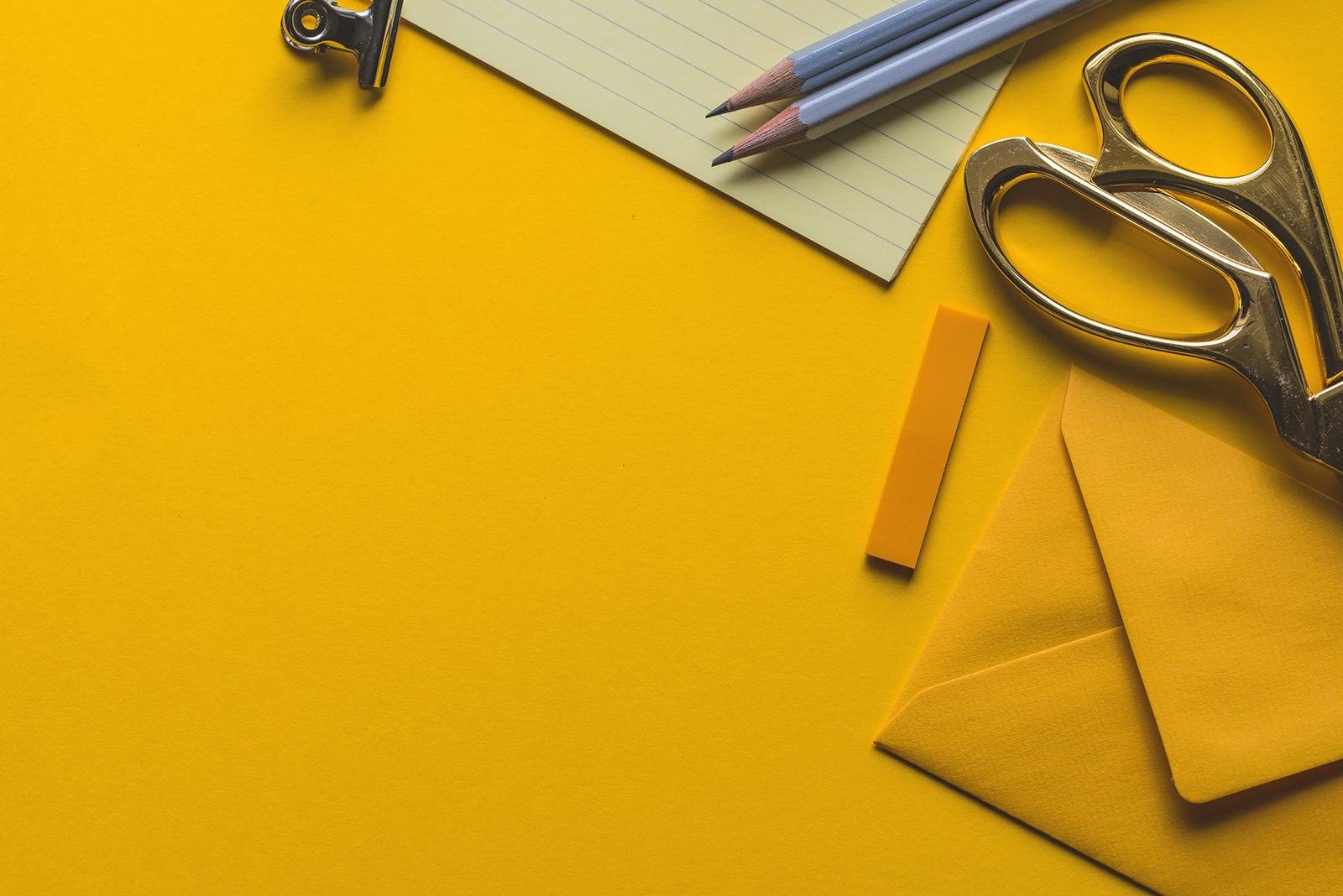 A tidy desk with stationery, ready for ongoing work